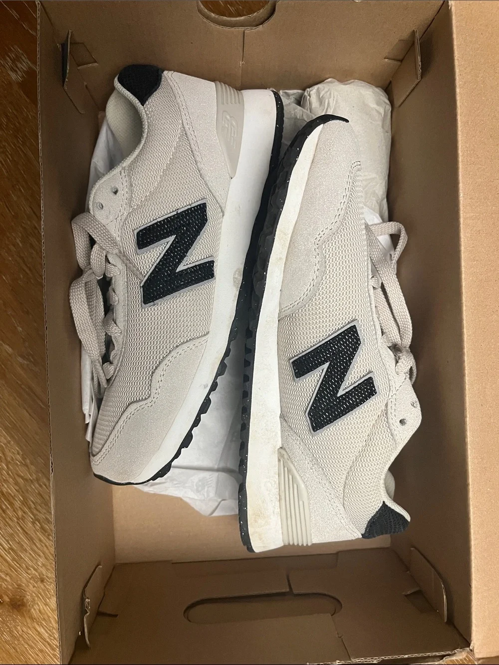New Balance Woman’s  Cream Sneaker with dark navy blue 'N' Accent